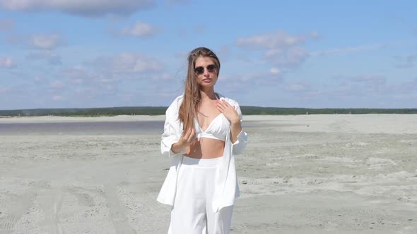 Beautiful Woman Walking on Shore