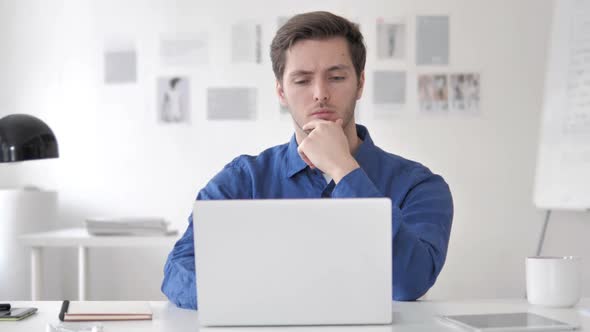 Pensive Casual Adult Man Thinking at Work