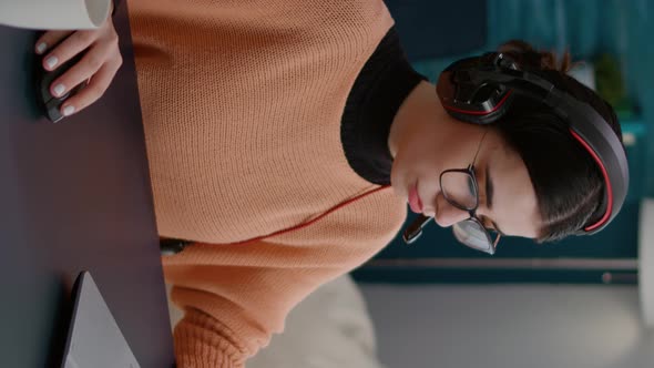 Vertical Video Female Student Using Laptop to Attend Remote Teleconference