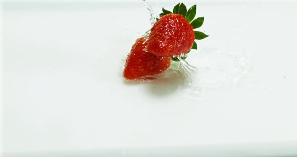 Strawberries, fragaria vesca, Falling on Water, Slow Motion 4K