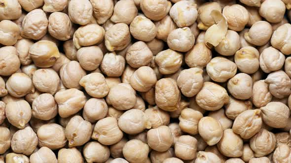 Close-up chickpeas, dry beans. chickpeas seeds abstract background. slider motion