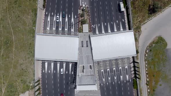 Time lapse of Traffic entering and leaving a toll road, Aerial view.
