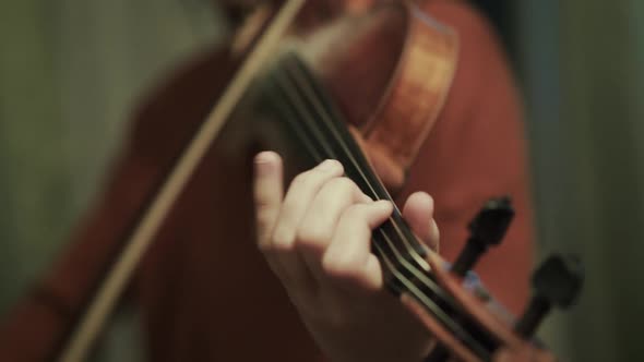 Close View of Fast Playing on the Violin By Young Girl During Rehearse in a Hall