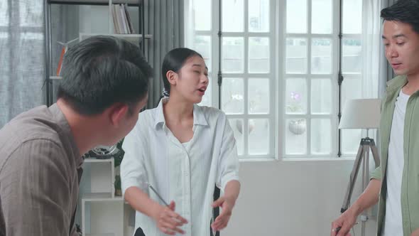 Serious Group Of Asian Engineers Discuss About Work At The Office, Angry Colleagues Debate Fight