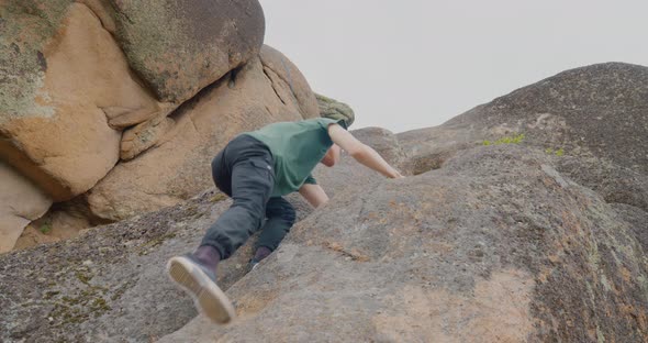 The man is climbing on the mount  The Krasnoyarsk Stolby