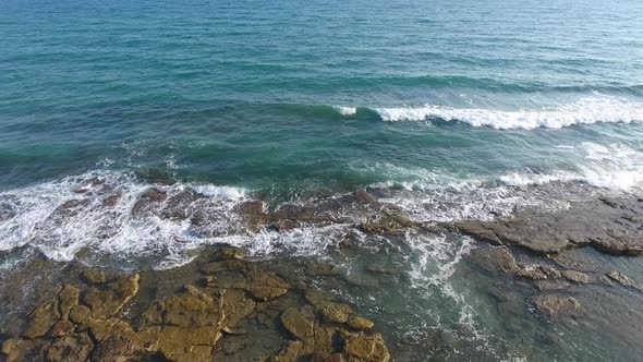 Shallow Rocky Reef Between the Sea and the Beach