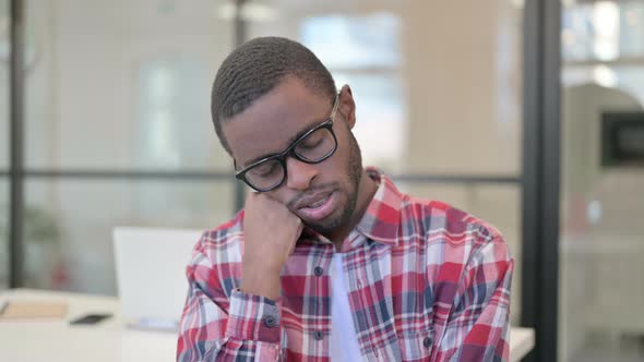 Portrait of Sleepy African Man Taking Nap