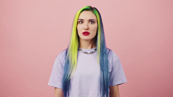 Young Surprised Lady with Colorful Hairstyle Looking Around and Shaking Head in Rejection Denying