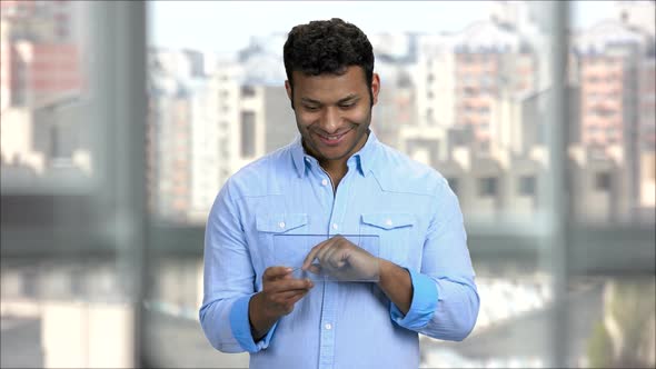 Young Indian Man Using Blank Transparent Tablet