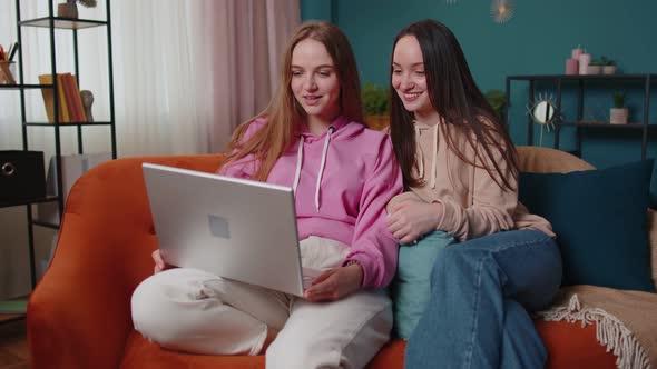 Young Teen Girls Friends Siblings Smiling Making Online Video Call Communication on Laptop Notebook