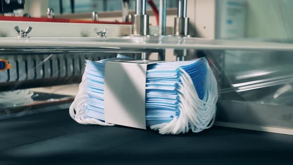 Batches of Medical Masks Are Getting Packaged Into Polyethylene