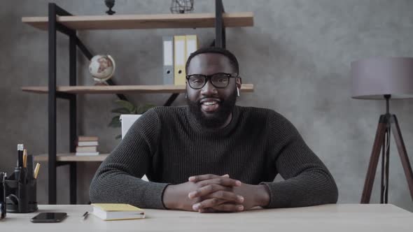 Excited African-American Young Guy in Glasses Looks Into Camera, Listens and Nods His Head . Video