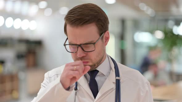 Portrait of Allergic Male Doctor Coughing 