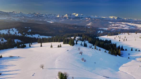 Aerial view of cold sunrise in Tatra mountains at winter