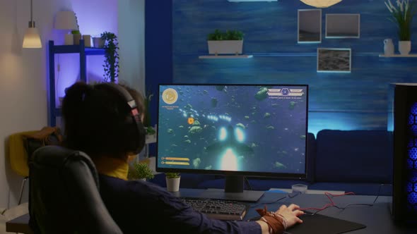 Woman Gamer Playing Space Shooter Video Game