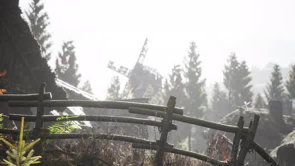 Old Traditional Wooden Windmill in the Forest alt