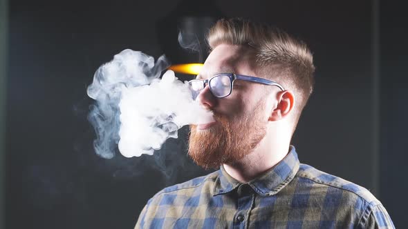 Brutal Handsome Ginger Man Is Smoking Hookah in the Bar