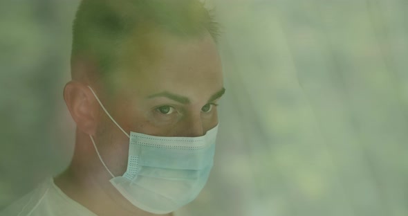 Portrait Of a Sad Young Man in Face Mask