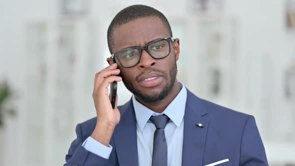 Portrait of Professional African Businessman Talking on Smartphone