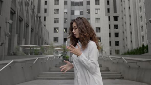 Girl Dressed In Business Style Dancing On The Street