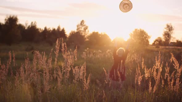 Portrait of Positive Smiling Woman Looking Into Camera at Sunset