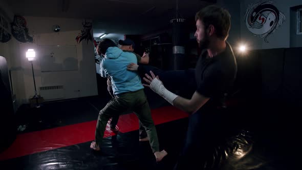 Fight Scene of Three Male Stunts on a Gym