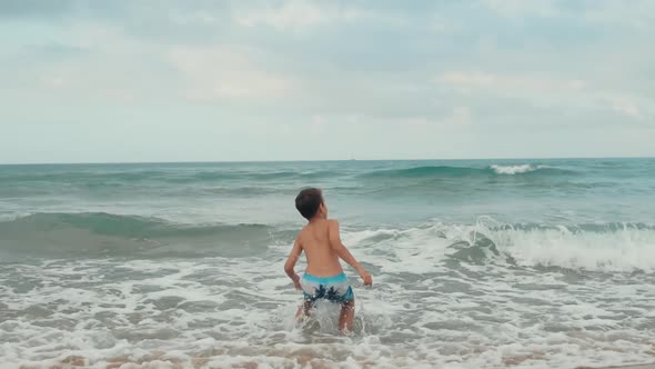 Happy Boy Enjoying Summer at Beach