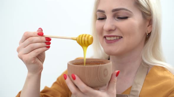 The Girl Pouring Honey To Sauce in