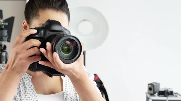 Photographer taking photo with professional digital camera