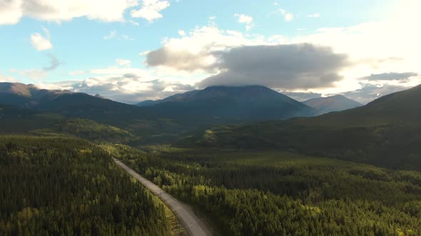 Beautiful View of Scenic Road Surrounded By Forest and Mountains
