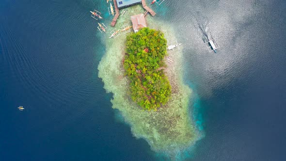 Aerial Top View Boat Pier in a Beautiful Tropical Bay on Sugba Lagoon in Siargao, Philippines.