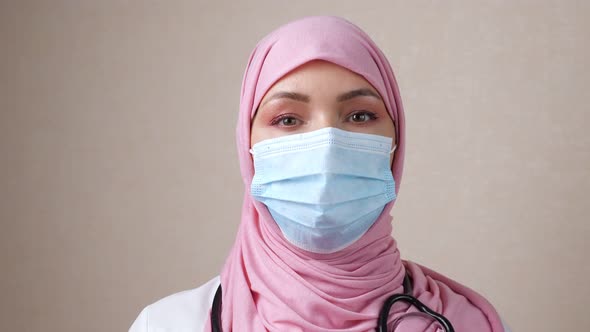 Female Doctor in Hijab with a Phonendoscope Around Neck and a Mask on Face