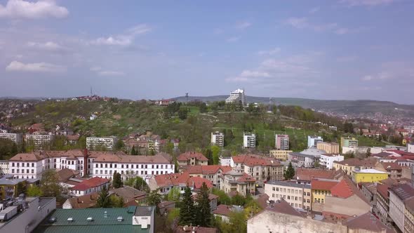 Aerial Drone Shot Over the Romanian City of Cluj-Napoca Revealing the Vast Landscape.