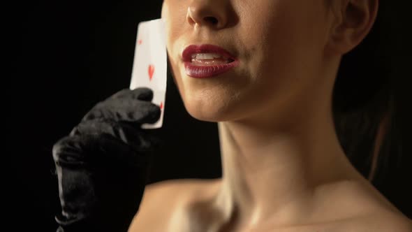 Elegant Woman Stroking Her Face With Ace of Hearts, Fortune Sign, Gambling