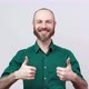 Happy bearded man in shirt showing thumbs sign up over white background. Good job - VideoHive Item for Sale