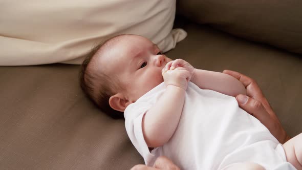 Middle Aged Father with Baby Daughter at Home