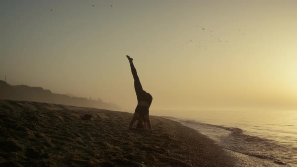 Silhouette Girl Stretching Standing on Head