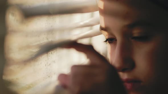 Portrait of a Pretty Girl Looking Out the Window