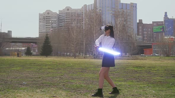 Female Warrior Practice Fencing with Laser Light Saber Swords in VR Goggles