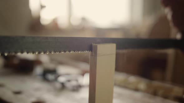 Man Producing Wooden Product Indoors