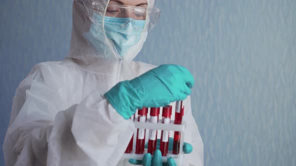 A Nurse Holds Blood Samples.