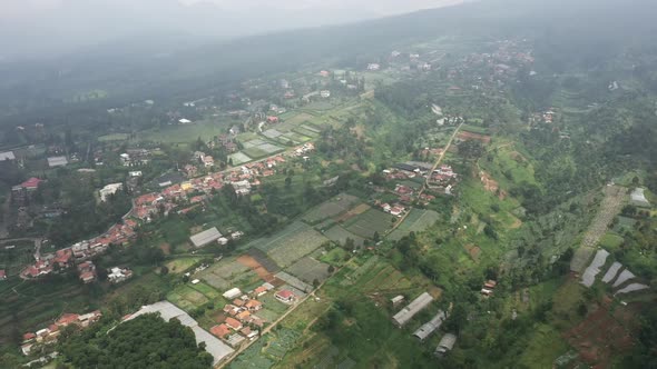 Aerial view of a foggy farm field in suburban area in Asia country