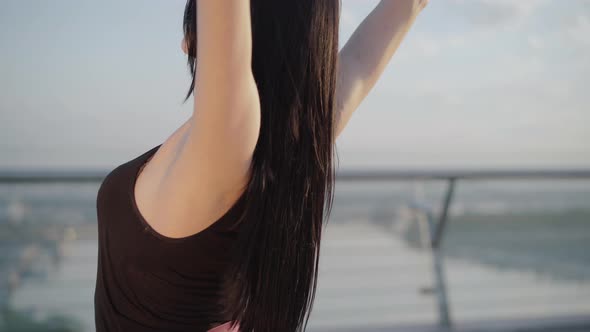 Close-up of Young Slim Elegant Woman Bending Back Outdoors. Portrait of Caucasian Ballerina Dancing