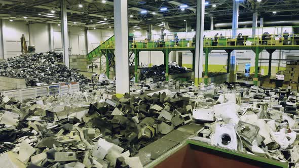 Spacious Premises of a Junkyard with Piles of Waste. Waste, Plastic Trash, Garbage Recycling Plant.