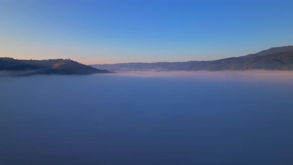 4K Aerial view of Mountains landscape with morning fog.