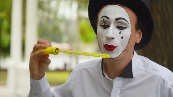 Fun Mime Blowing Soap Bubbles Outdoors