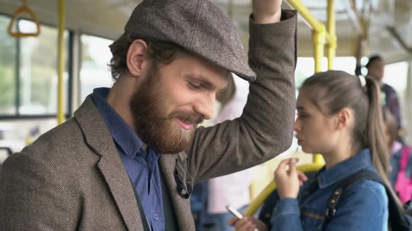 Stylish Man Communicating via Tablet in Trolleybus