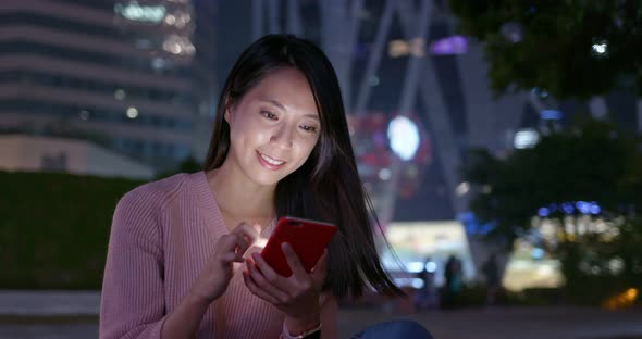 Woman use of mobile phone online