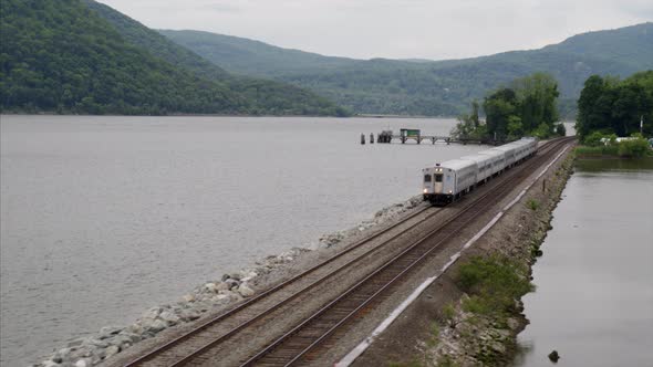 Commuter Train Passing Over the Hudson River Aerial