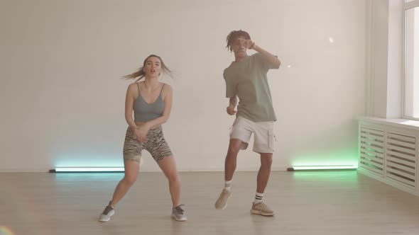 Two Young People Dancing in Studio